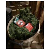 Can full of flexible branch garland