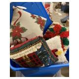 Tote full of various decorative Christmas pillows
