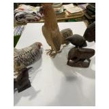 Collection of wooden chickens and other wooden
