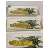 Three ceramic corn cob holding trays