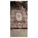 Red decorative area rug 73in x 110in