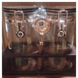 Glass 8 inch tall canister set with wooden holder