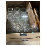 Old glass jars and wooden paper towel holder