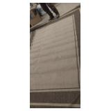 Brown area rug 90in x 127in