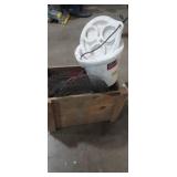 Wooden crate with fishing supplies and rod and