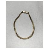 14k bracelet safety clasp marked 14k.   .175oz