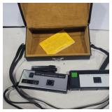 2 kodak cameras and a camera case