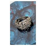 Openwork filigree style ring featuring an ornate