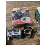 Three fishing reels, quantum bait caster