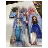 2 Barbie dolls, 2 Disney, frozen dolls, and Ken