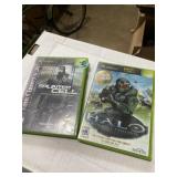 2 Xbox games, Halo and splinter cell with
