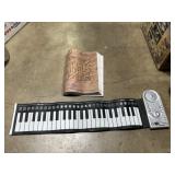 Fold up keyboard and Beatles music book