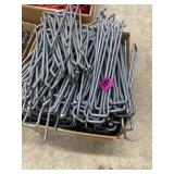 Box full of pegboard hangers