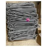 Large box of pegboard hangers