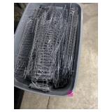 Tote full of stainless pegboard wire shelving