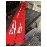 Three used Milwaukee pegboard signs