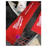 Three used Milwaukee pegboard signs