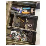 Drawer contents flashlights, screwdrivers, nuts,