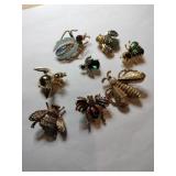 Group of fly gold tone brooches