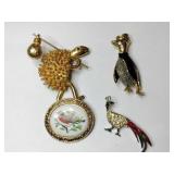 Gold tone animal brooches