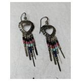 Silver heart-shaped dangle earrings marked