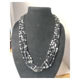 Multi-strand black and white beaded necklace