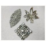 3 silver tone clear rhinestone brooches