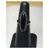 Silver Navajo black onyx ring size 4.     .115oz