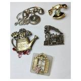 Multi shape brooches phones ,train ,flower pot,