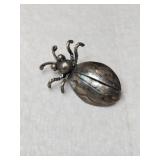 Silver bug pin unmarked.   .205oz