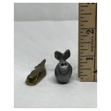 Miniature metal whale figurines