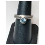 Silver light blue band ring marked 925.  'ND'