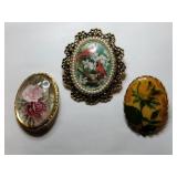 3  gold tone porcelain and resin flower brooches