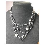 Multi-strand black and white beaded necklace
