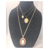 3 gold tone Cameo necklaces