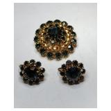 Gold tone gray or dark green rhinestone brooch