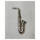 Beaur saxophone brooch marked Sterling.    .130oz