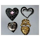 Gold and silver tone heart brooches