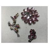 3 pink rhinestone brooches (one missing a stone)