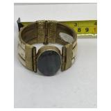 Brass hinged cuff bracelet with dark stone