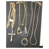 Group of five gold tone necklaces