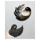 Gold and silver tones swan brooches