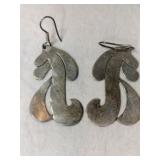 Silver design dangle earrings marked Mexico 925.