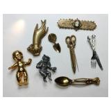 Multi-shaped brooches spoons, scissors, hand,