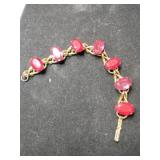 Gold tone red rhinestone link bracelet