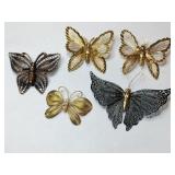Gold tone and black metal butterfly brooches