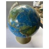 Full size glove on metal base