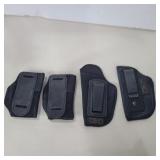 4 small pistol holsters 2 uncle Mike's and 2 un
