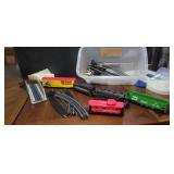 Box of trains and tracks with tressle