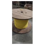 Wooden spool with nylon rope